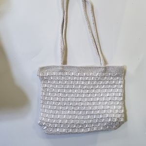 NWOT Beautiful White Handbag Crocheted & has Satin Ribbon Woven in. Immaculate